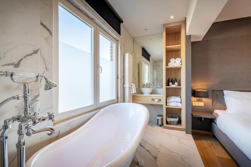 Postel nebo postele na pokoji v ubytování Hotel Carlton