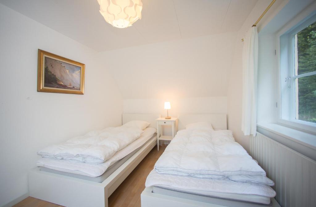 Postel nebo postele na pokoji v ubytování Snowwhites House