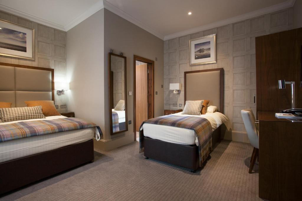 Postel nebo postele na pokoji v ubytování Cruachan Hotel