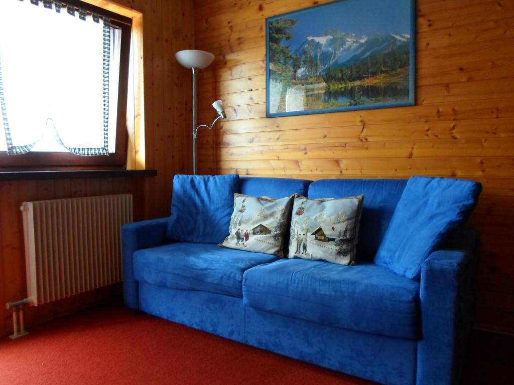 Posedenie v ubytovaní Appartamenti Dolomiti con piscina e sauna
