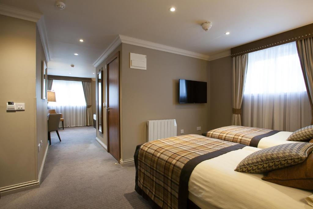 Postel nebo postele na pokoji v ubytování Cruachan Hotel