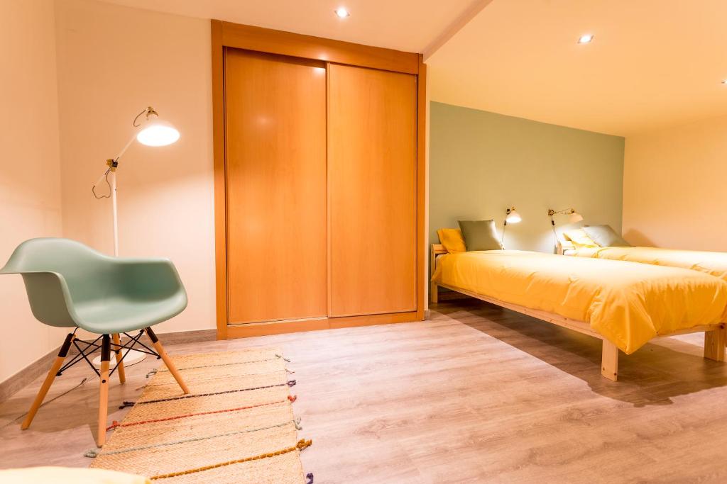Ένα ή περισσότερα κρεβάτια σε δωμάτιο στο Casa MODERNA con Terraza Chill Out - Estadio BERNABÉU