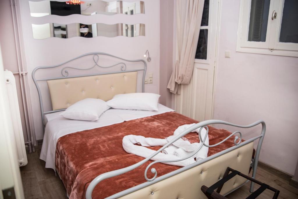 Postel nebo postele na pokoji v ubytování Asimoni Pension