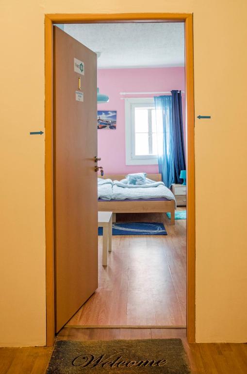 Postel nebo postele na pokoji v ubytování Rooms and Apartment Veral-KA