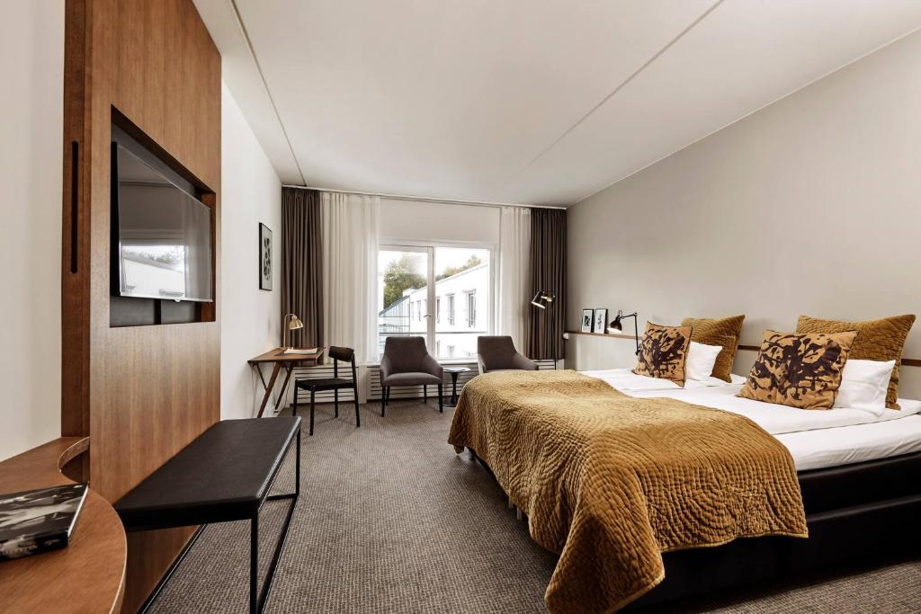 Ein Bett oder Betten in einem Zimmer der Unterkunft Comwell Borupgaard