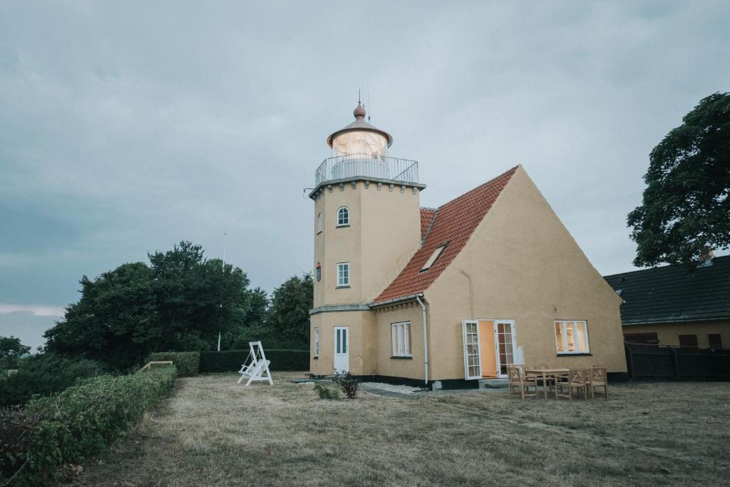 a large building with a lighthouse on top of it at The Light House in Borre