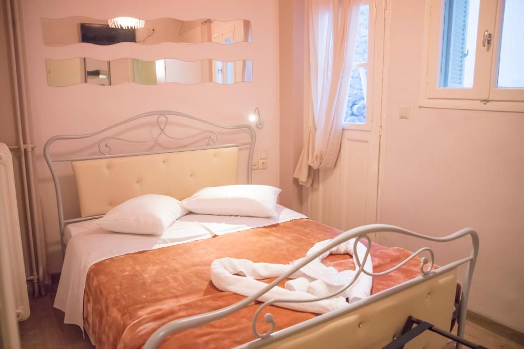 Postel nebo postele na pokoji v ubytování Asimoni Pension