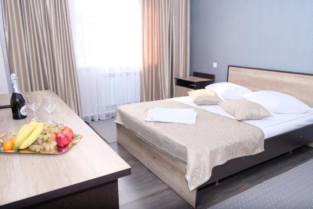 Postel nebo postele na pokoji v ubytování ORIENT