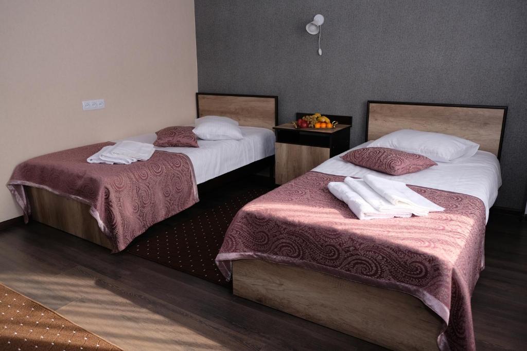 Postel nebo postele na pokoji v ubytování ORIENT