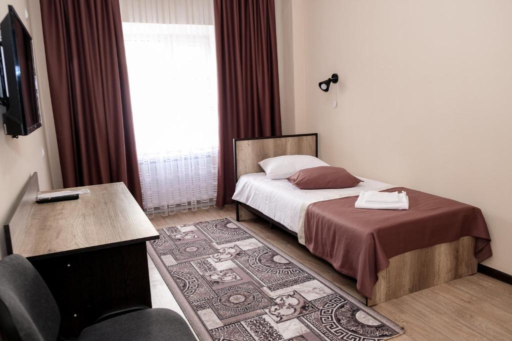 Postel nebo postele na pokoji v ubytování ORIENT