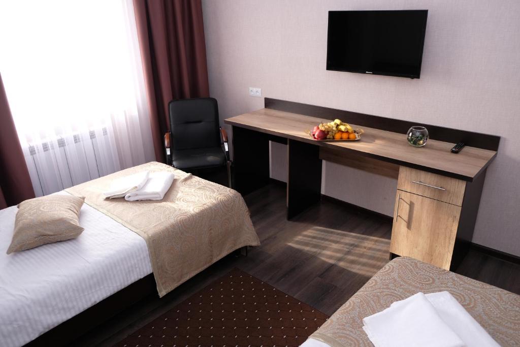 Postel nebo postele na pokoji v ubytování ORIENT