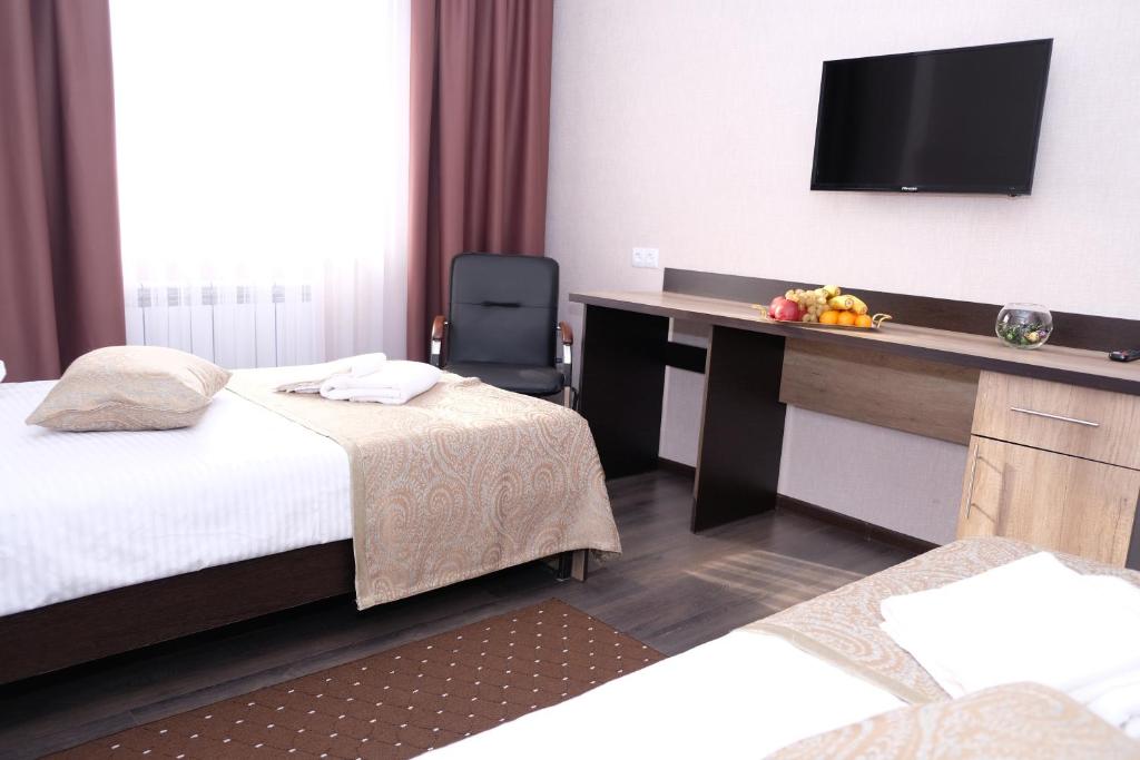Postel nebo postele na pokoji v ubytování ORIENT