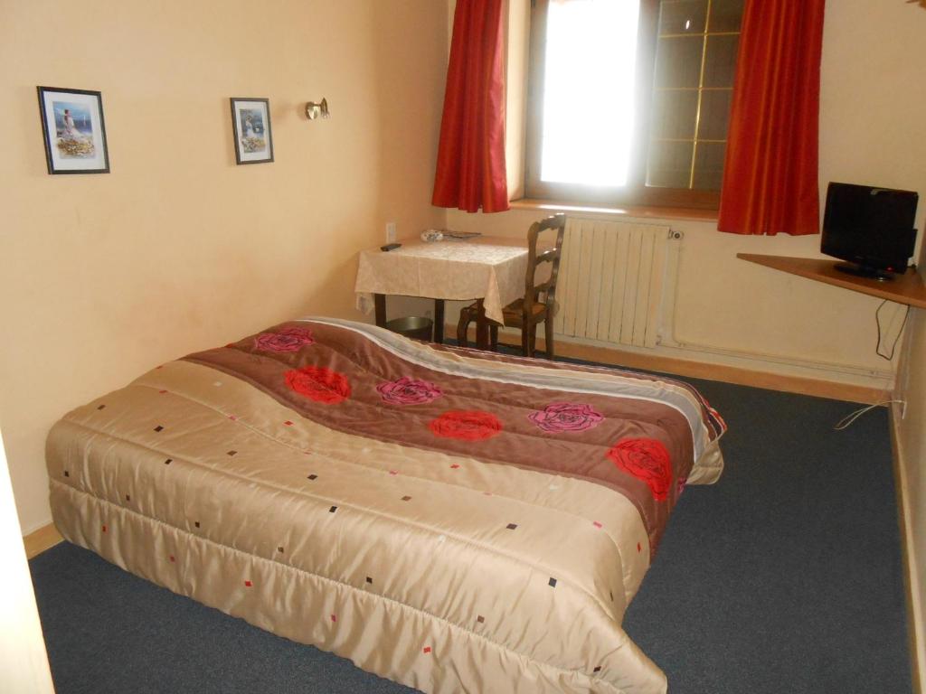 Postel nebo postele na pokoji v ubytování Le Logis du Pré Braheux