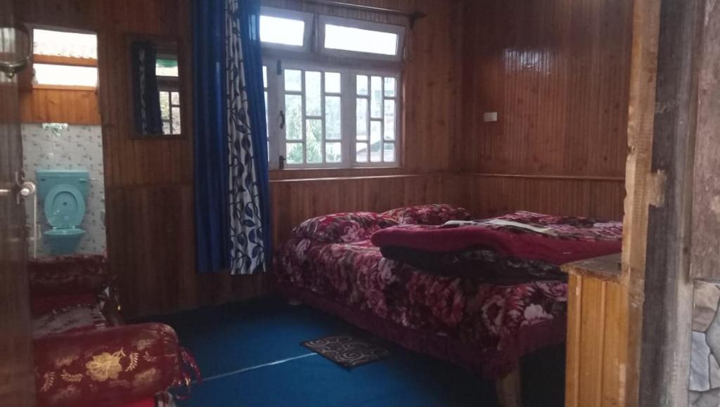 Posezení v ubytování Vamoose Sinkawli Homestay