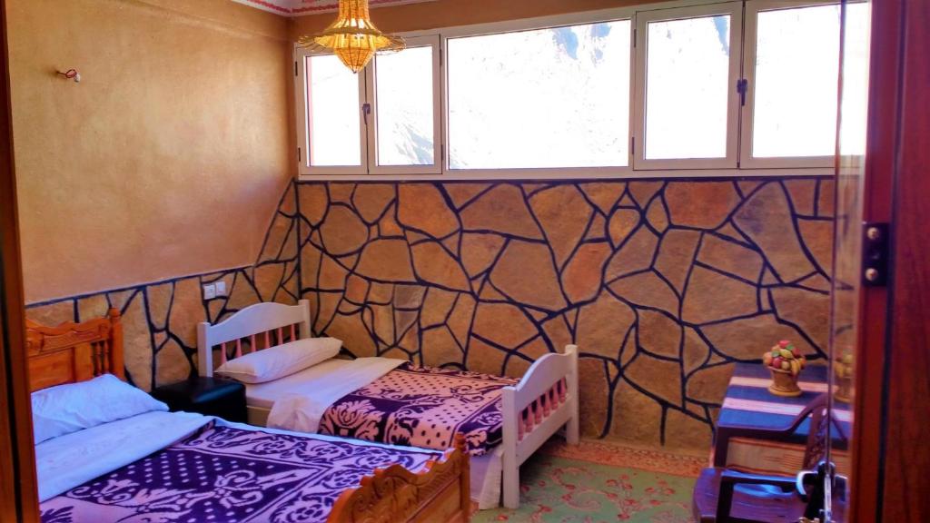 Postel nebo postele na pokoji v ubytování Dounia Hostel