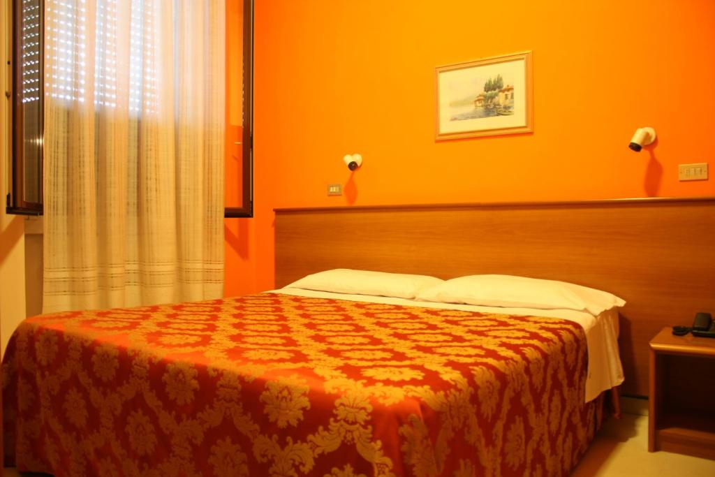 Postel nebo postele na pokoji v ubytování Hotel Garden