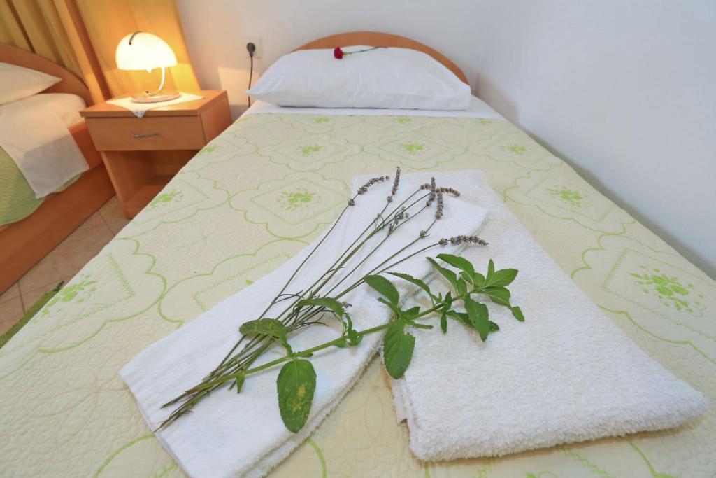 Posteľ alebo postele v izbe v ubytovaní Apartments Romansa