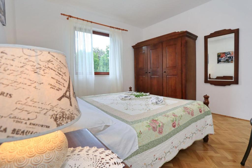 Posteľ alebo postele v izbe v ubytovaní Apartments Romansa