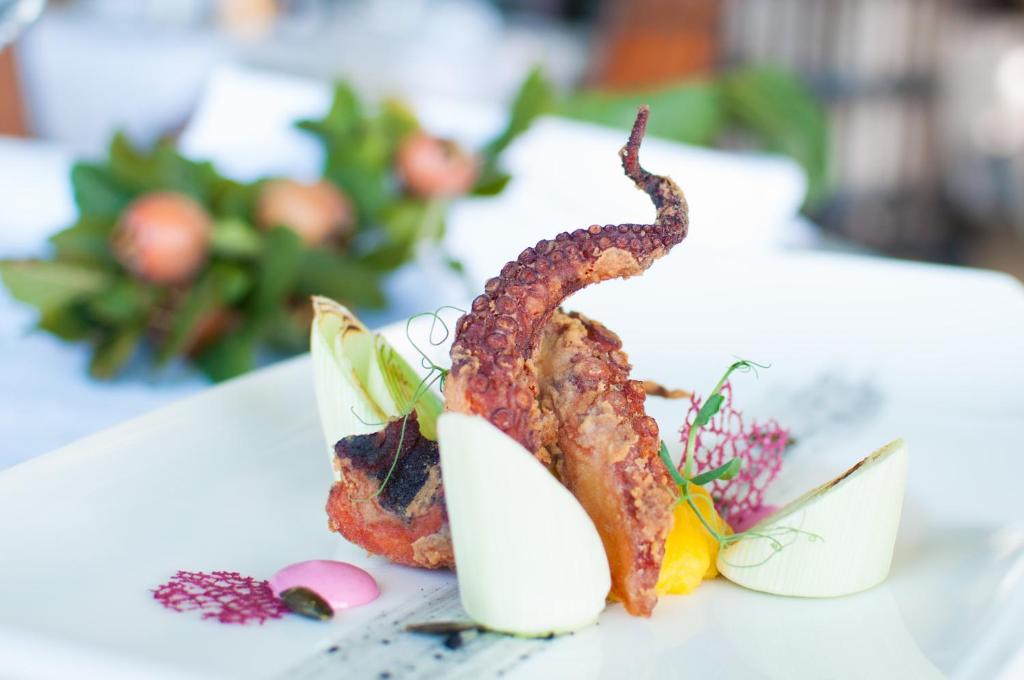 a plate of food with a lobster on a table at Hotel Marina in Izola