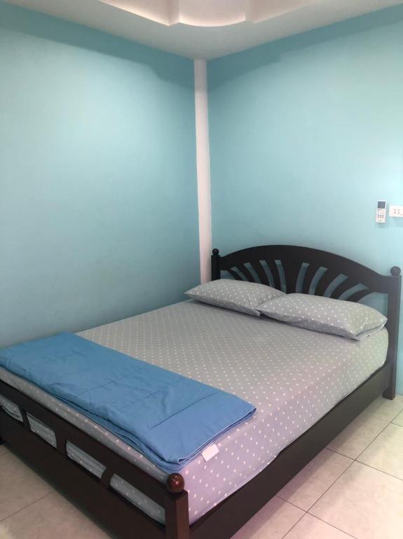 Postel nebo postele na pokoji v ubytování Bann Pa Su (บ้านป้าสุ)