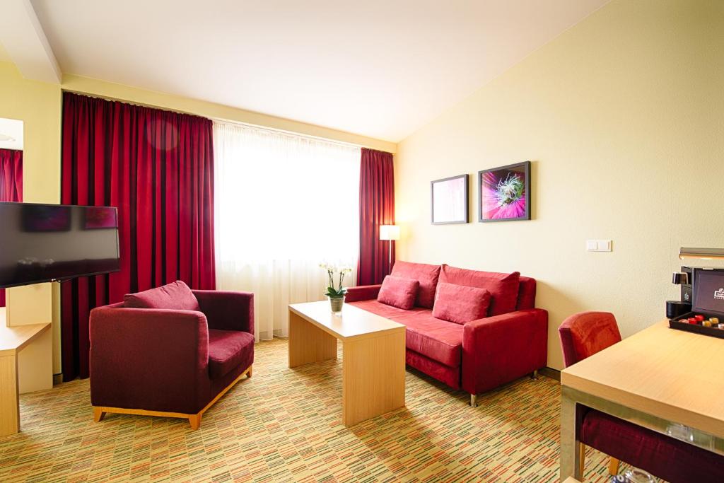 TV a/nebo společenská místnost v ubytování Welcome Hotel Paderborn
