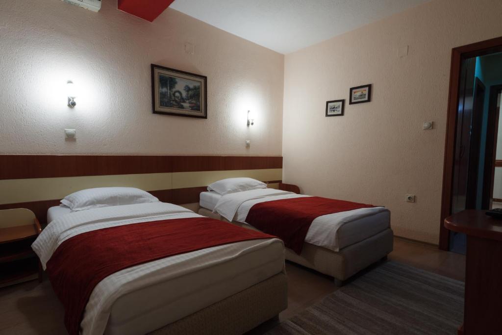Postel nebo postele na pokoji v ubytování Hotel Ilinden