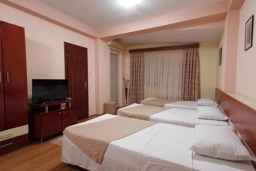 Postel nebo postele na pokoji v ubytování Hotel Ilinden