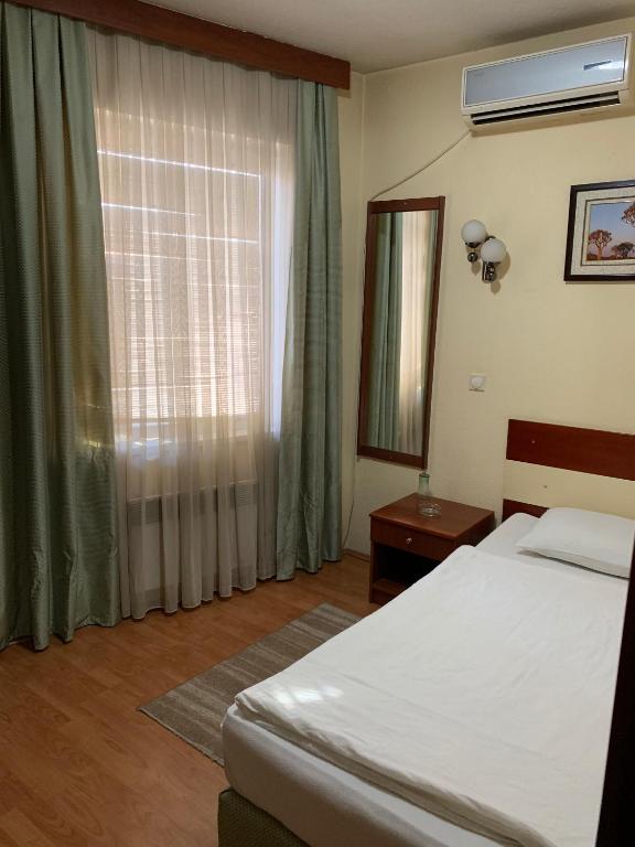 Postel nebo postele na pokoji v ubytování Hotel Ilinden