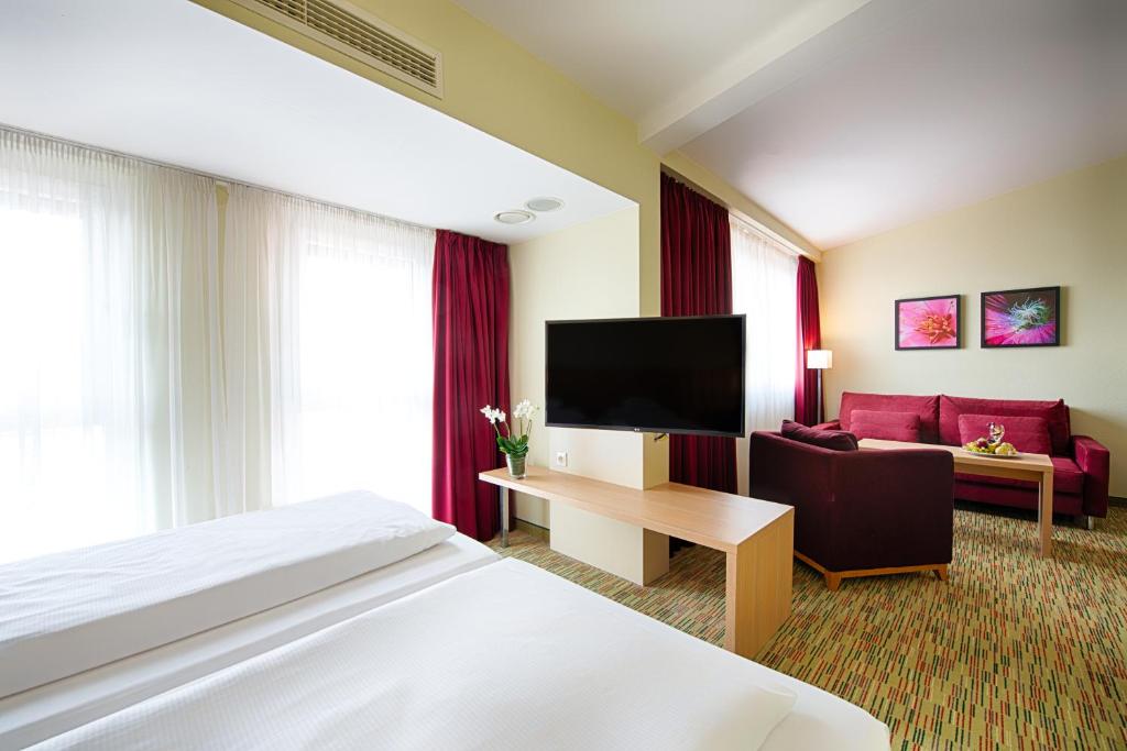 TV a/nebo společenská místnost v ubytování Welcome Hotel Paderborn
