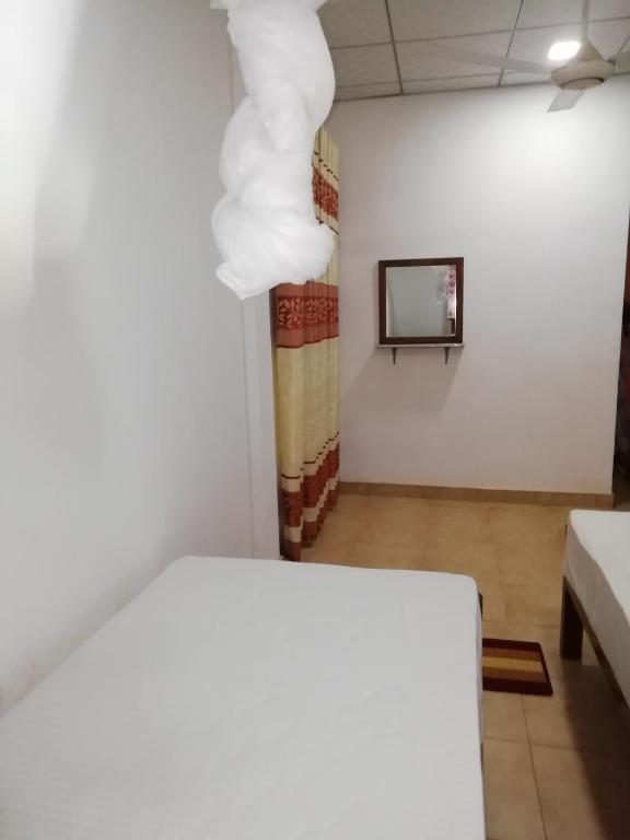 Postel nebo postele na pokoji v ubytování BAS Home Stay