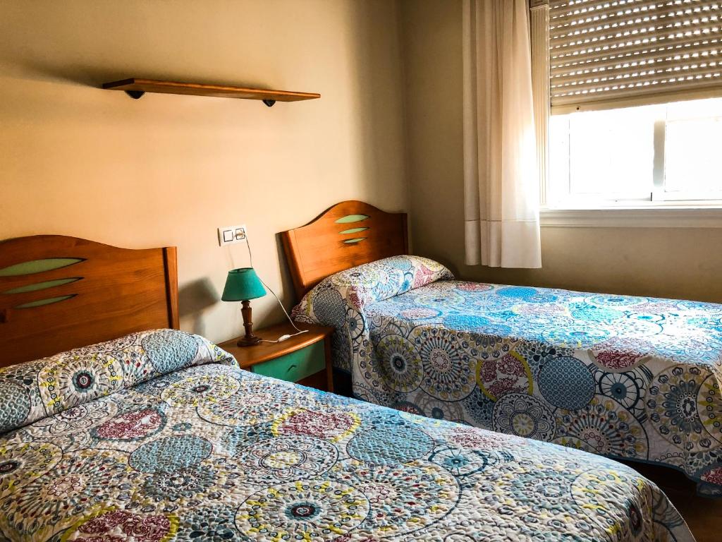 Posteľ alebo postele v izbe v ubytovaní Apartamentos Playa Areas