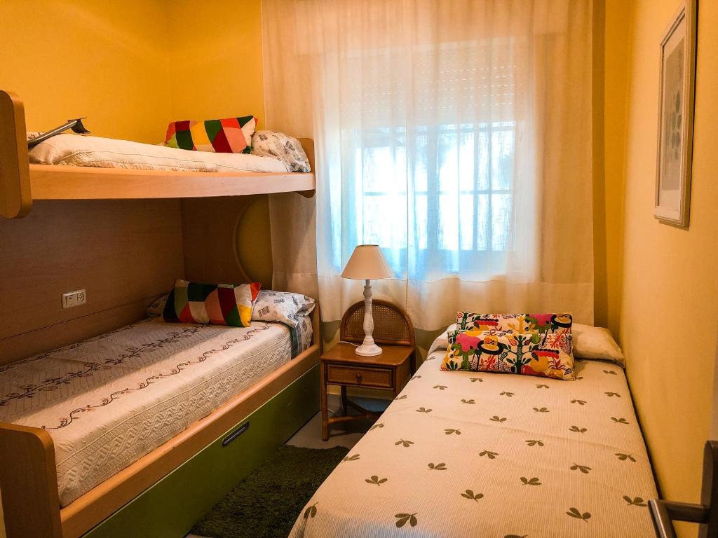 Posteľ alebo postele v izbe v ubytovaní Apartamentos Playa Areas