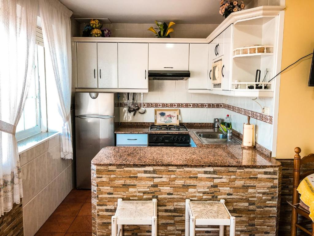 Kuchyňa alebo kuchynka v ubytovaní Apartamentos Playa Areas