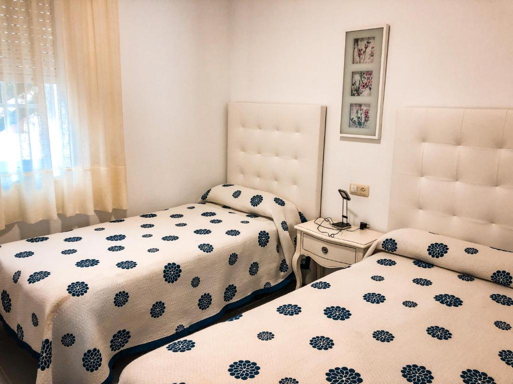 Posteľ alebo postele v izbe v ubytovaní Apartamentos Playa Areas
