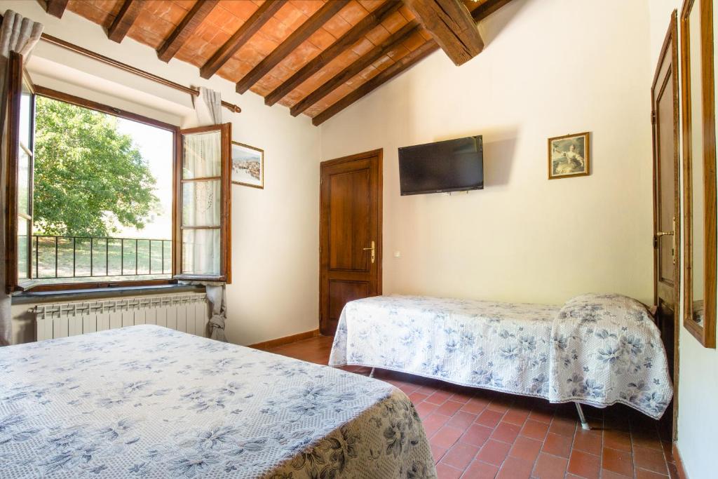 A bed or beds in a room at Villa Rinascimento Depandance