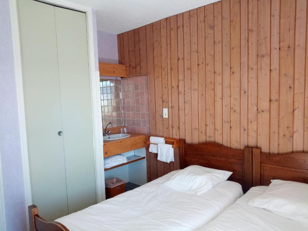 Postel nebo postele na pokoji v ubytování Espace Morteau