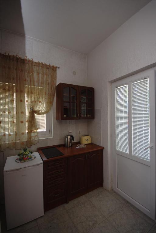 Kuchyň nebo kuchyňský kout v ubytování Apartments Astel