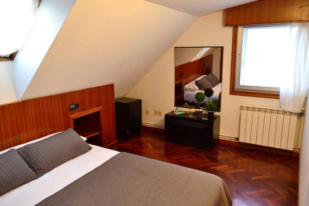 Postel nebo postele na pokoji v ubytování Apartamentos Alda Santa Cristina