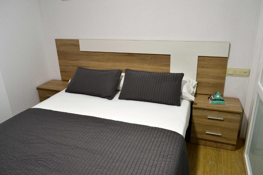 Postel nebo postele na pokoji v ubytování Apartamentos Alda Santa Cristina
