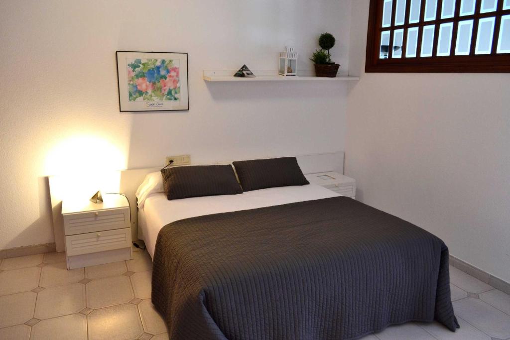 Postel nebo postele na pokoji v ubytování Apartamentos Alda Santa Cristina