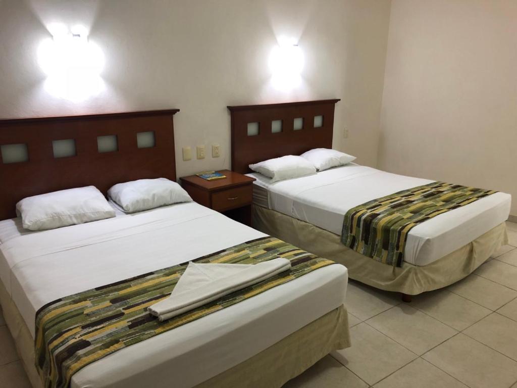 Postel nebo postele na pokoji v ubytování Hotel Xcalak