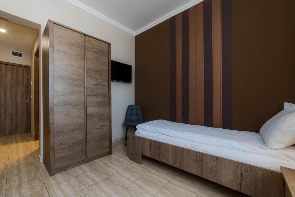 Postel nebo postele na pokoji v ubytování Sky Hotel