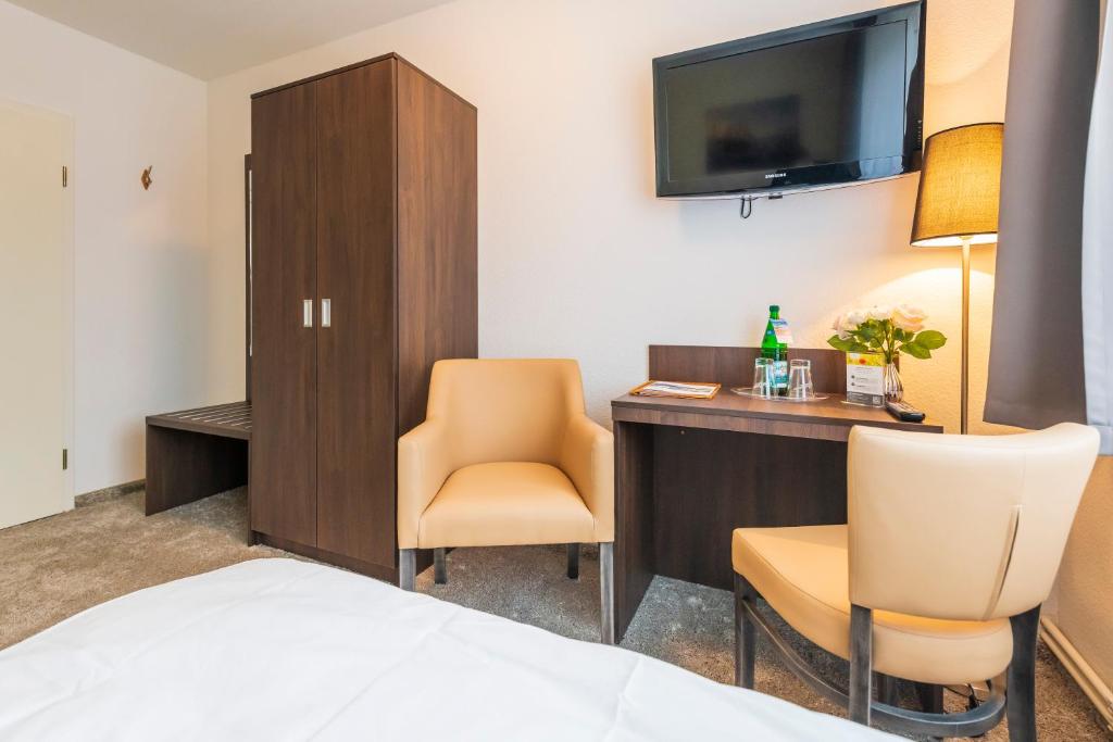 TV a/nebo společenská místnost v ubytování Hotel Mukran