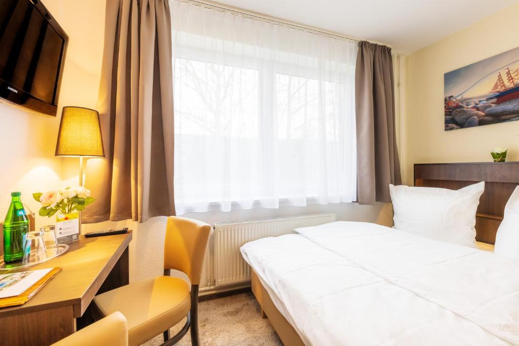 Postel nebo postele na pokoji v ubytování Hotel Mukran