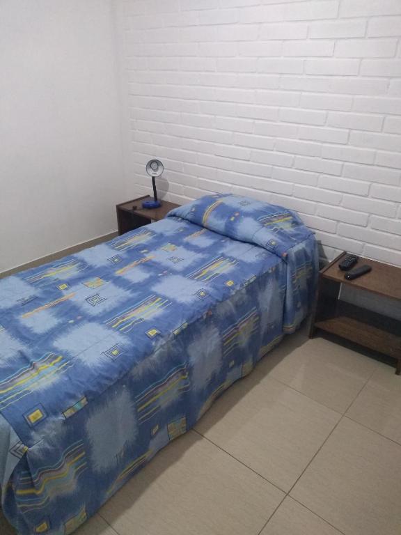 Postel nebo postele na pokoji v ubytování Hotel Angamos