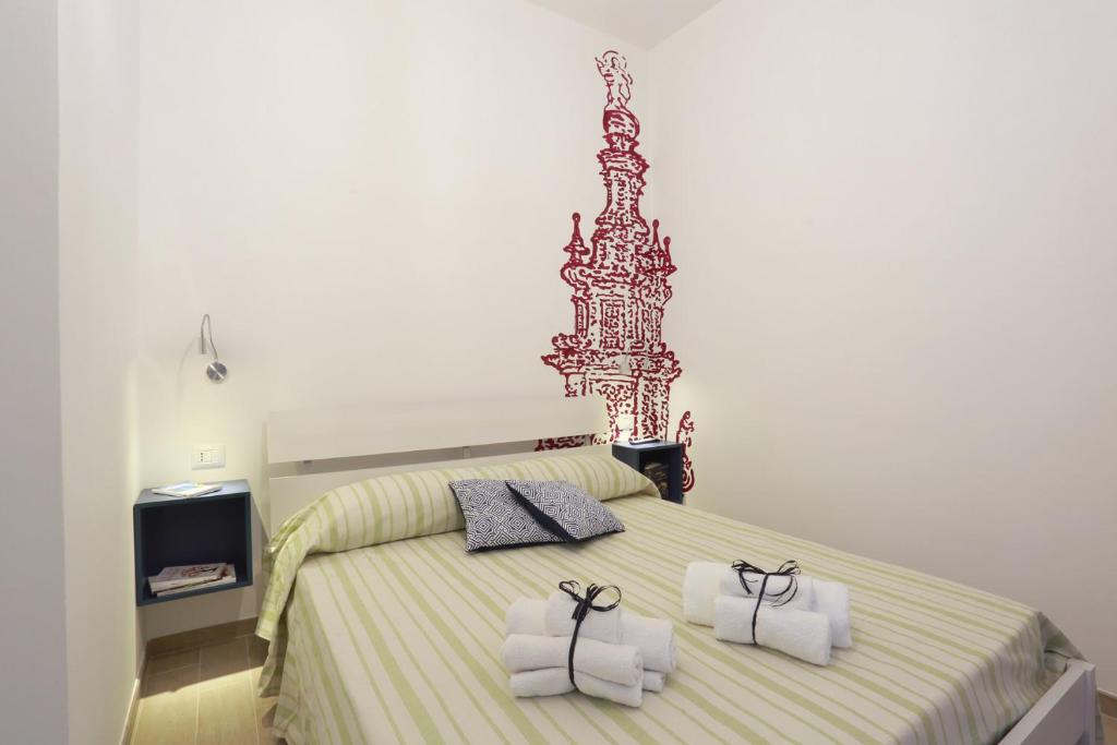 Postel nebo postele na pokoji v ubytování B&B EVO Nardò