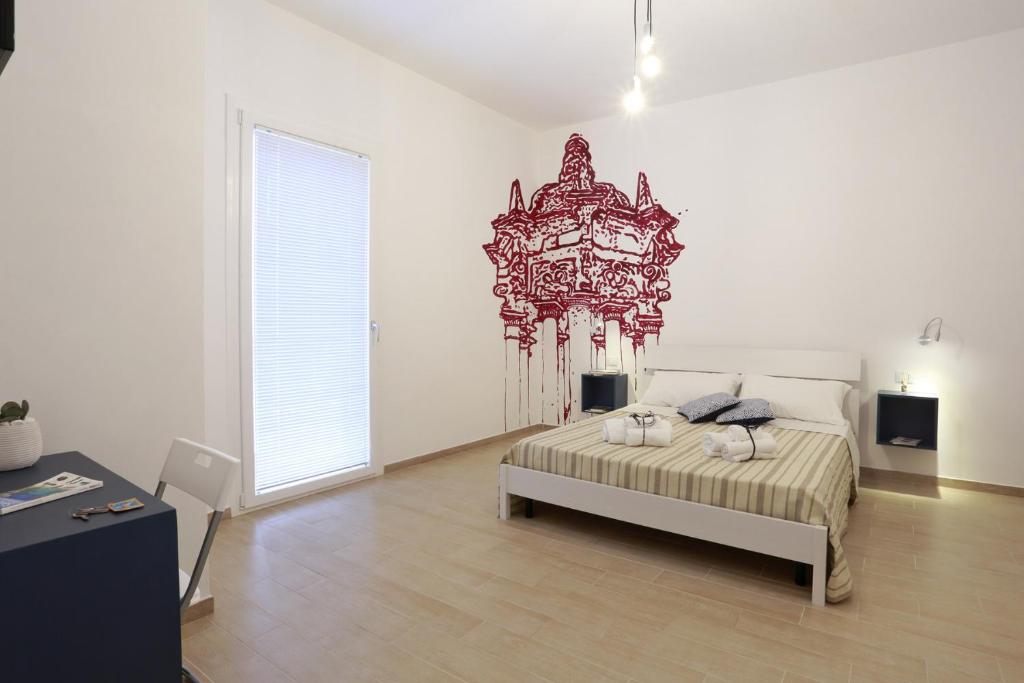 Postel nebo postele na pokoji v ubytování B&B EVO Nardò