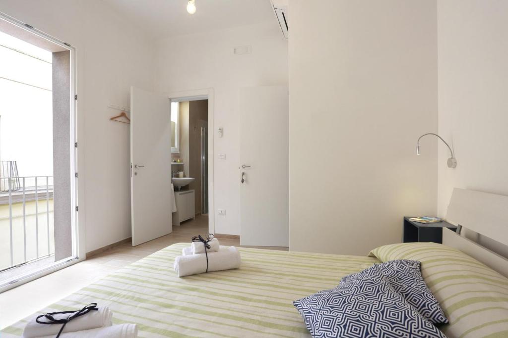 Postel nebo postele na pokoji v ubytování B&B EVO Nardò