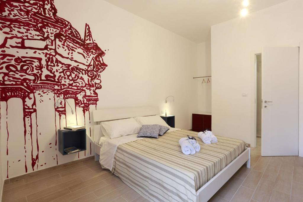Postel nebo postele na pokoji v ubytování B&B EVO Nardò