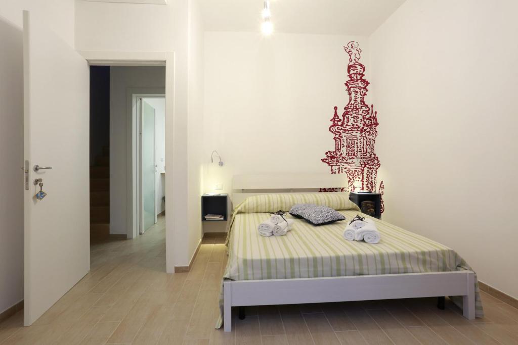 Postel nebo postele na pokoji v ubytování B&B EVO Nardò